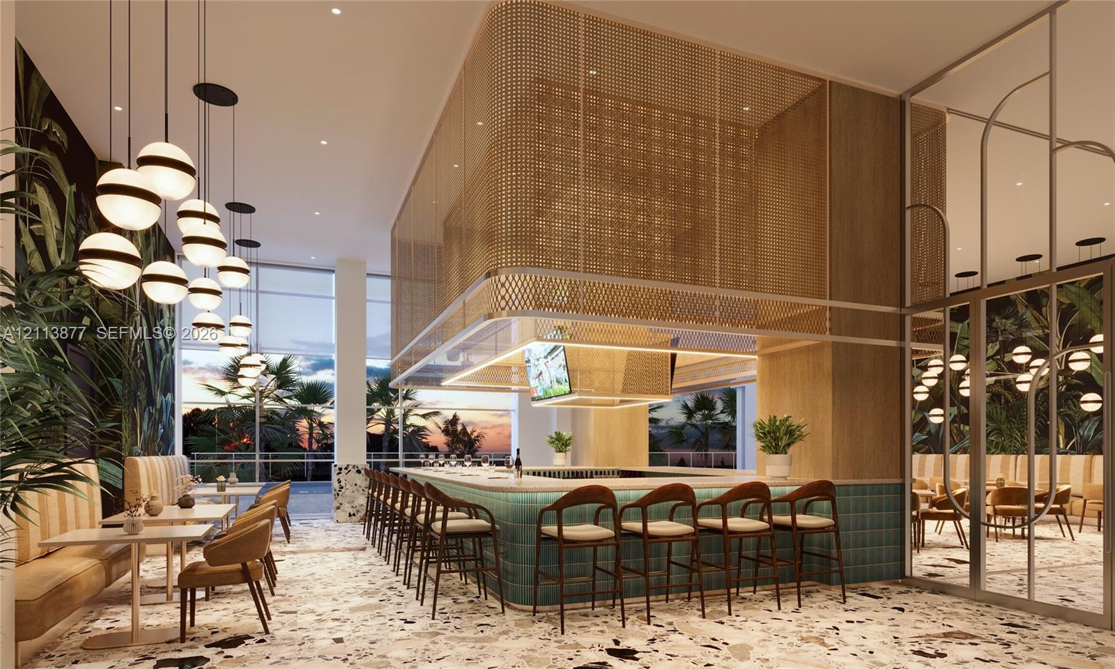 Central bar featuring a stone-topped counter with teal tile cladding, a suspended gold-tone metal mesh canopy, floor-to-ceiling glass paneling, terraz