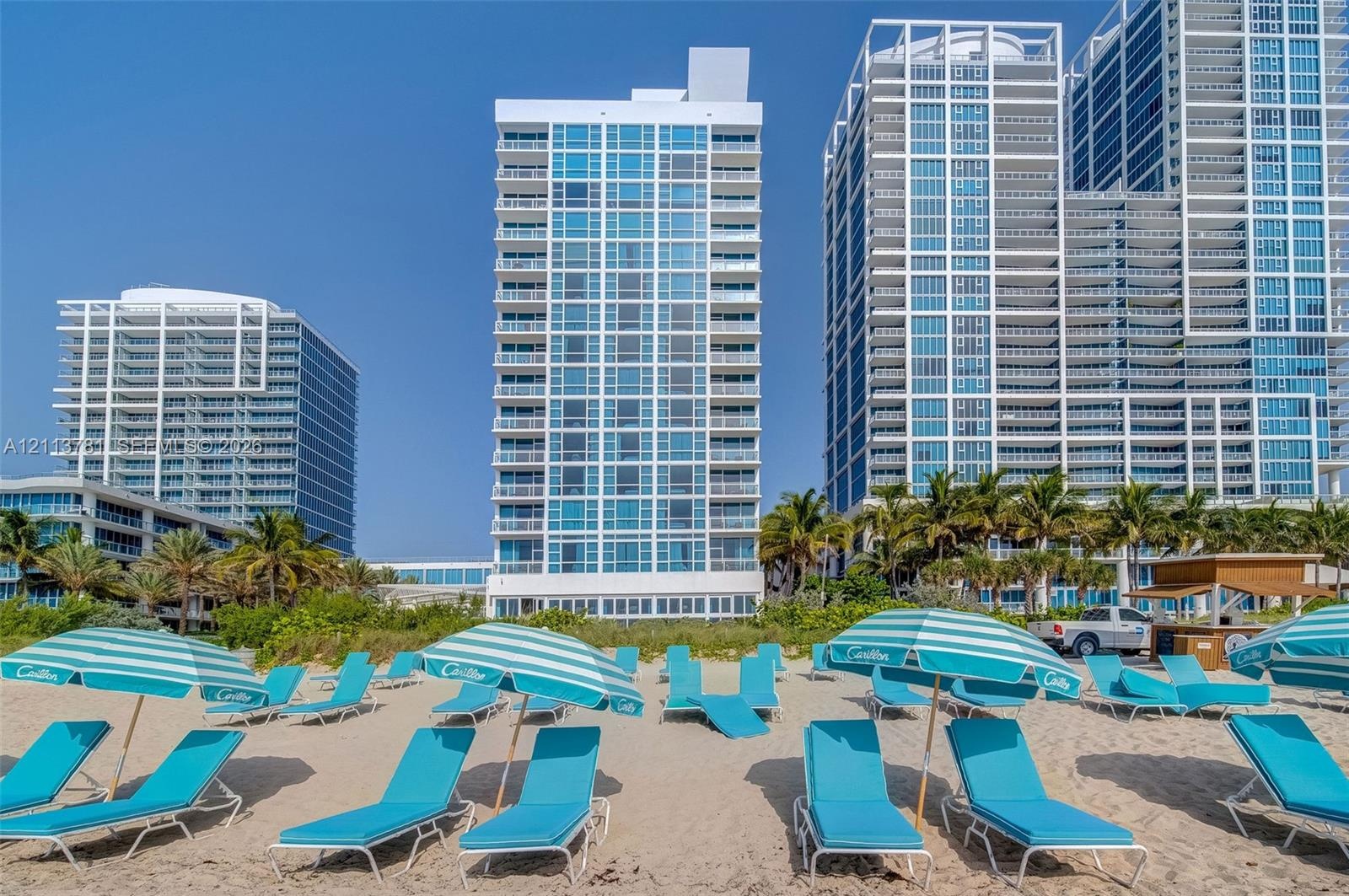 Beach club for residents, including chairs, towels, umbrellas, and food and beverage service