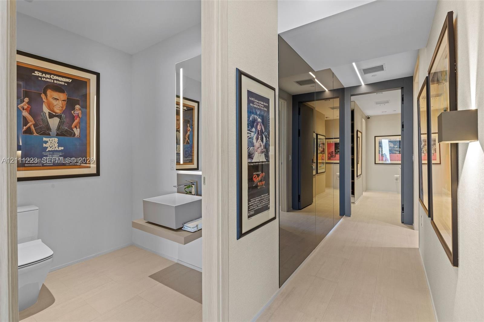 Hallway leading to guest bath, primary room & 2nd bedroom