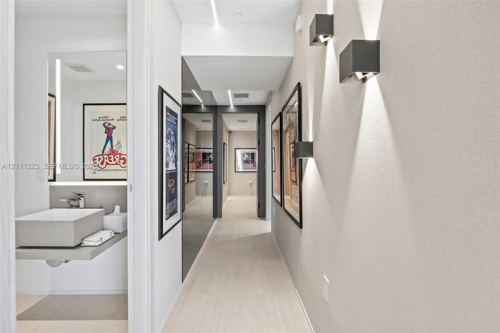 Hallway leading to guest bath, primary room & 2nd bedroom