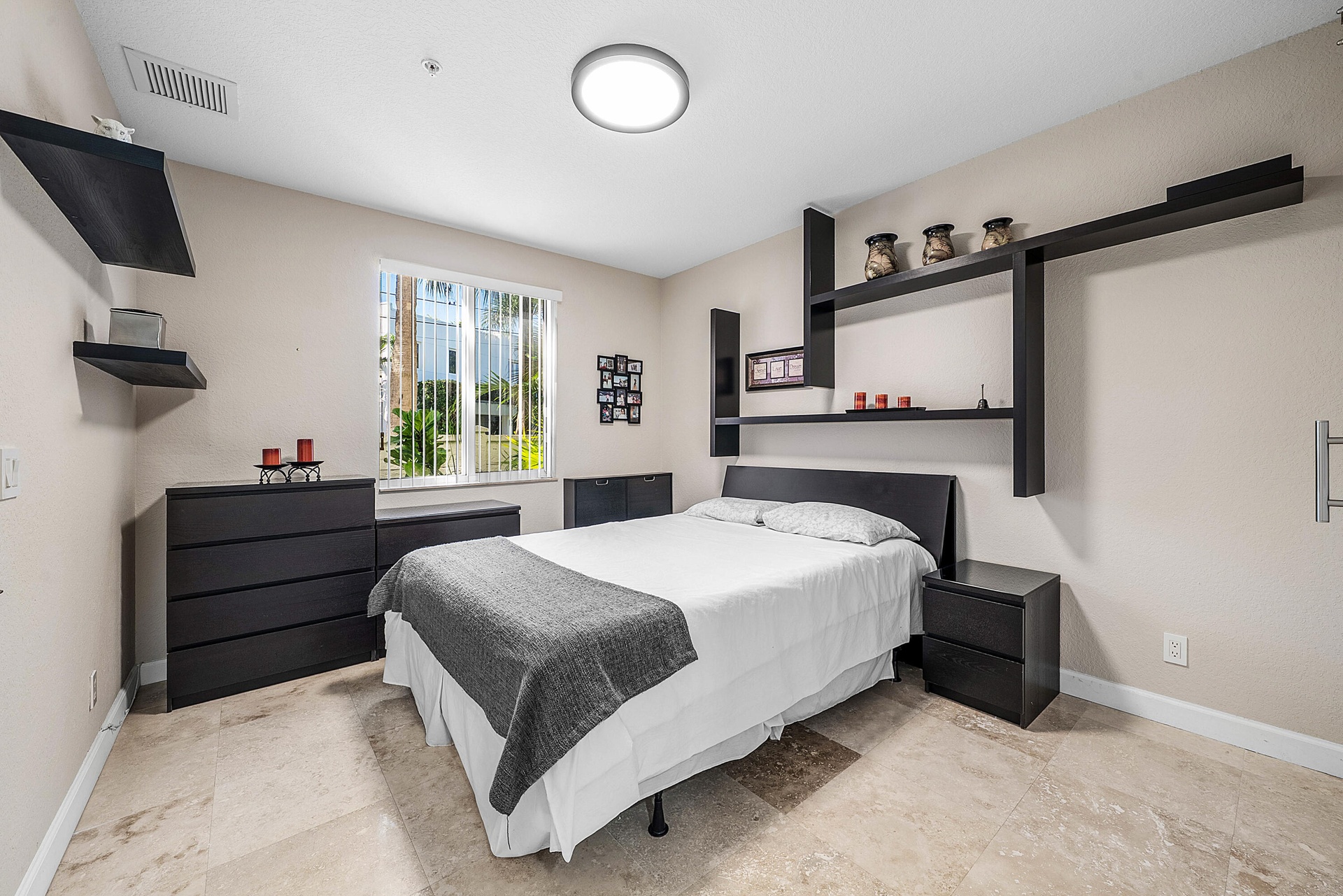 En-suite bedroom with full bath and walk-in closet with barn door