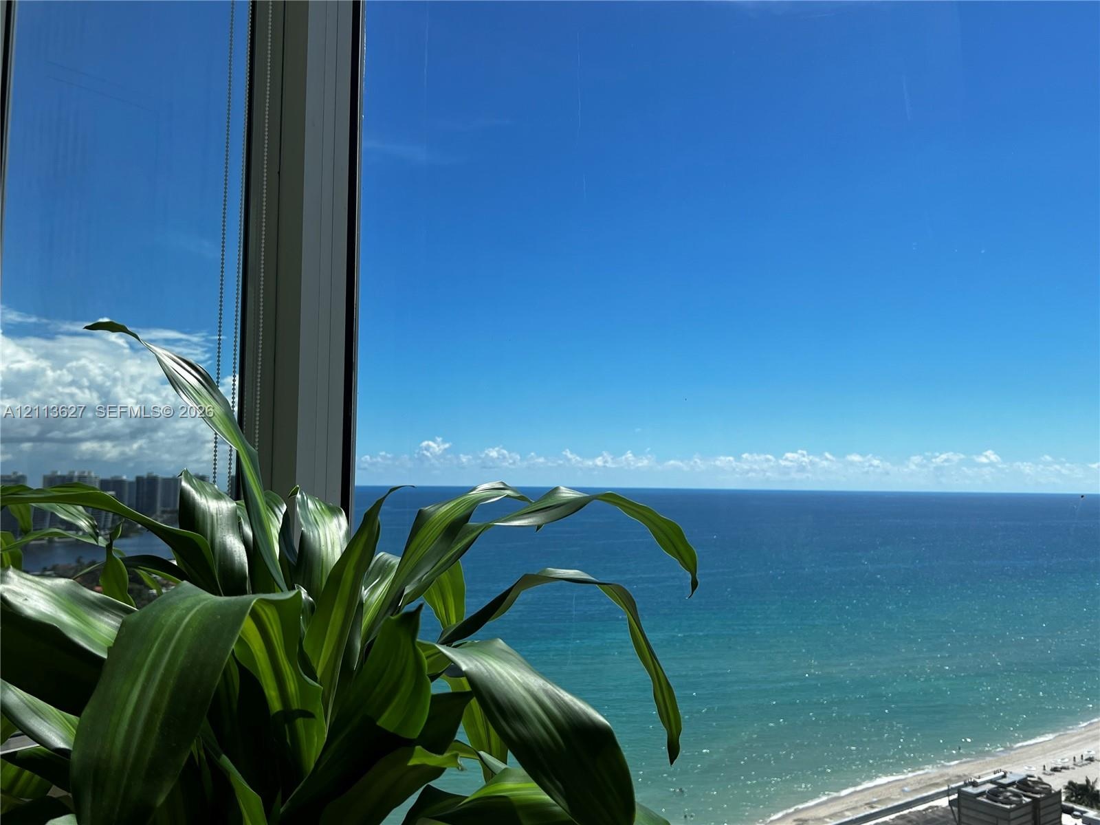 Floor-to-ceiling windows featuring panoramic ocean and coastline exposure