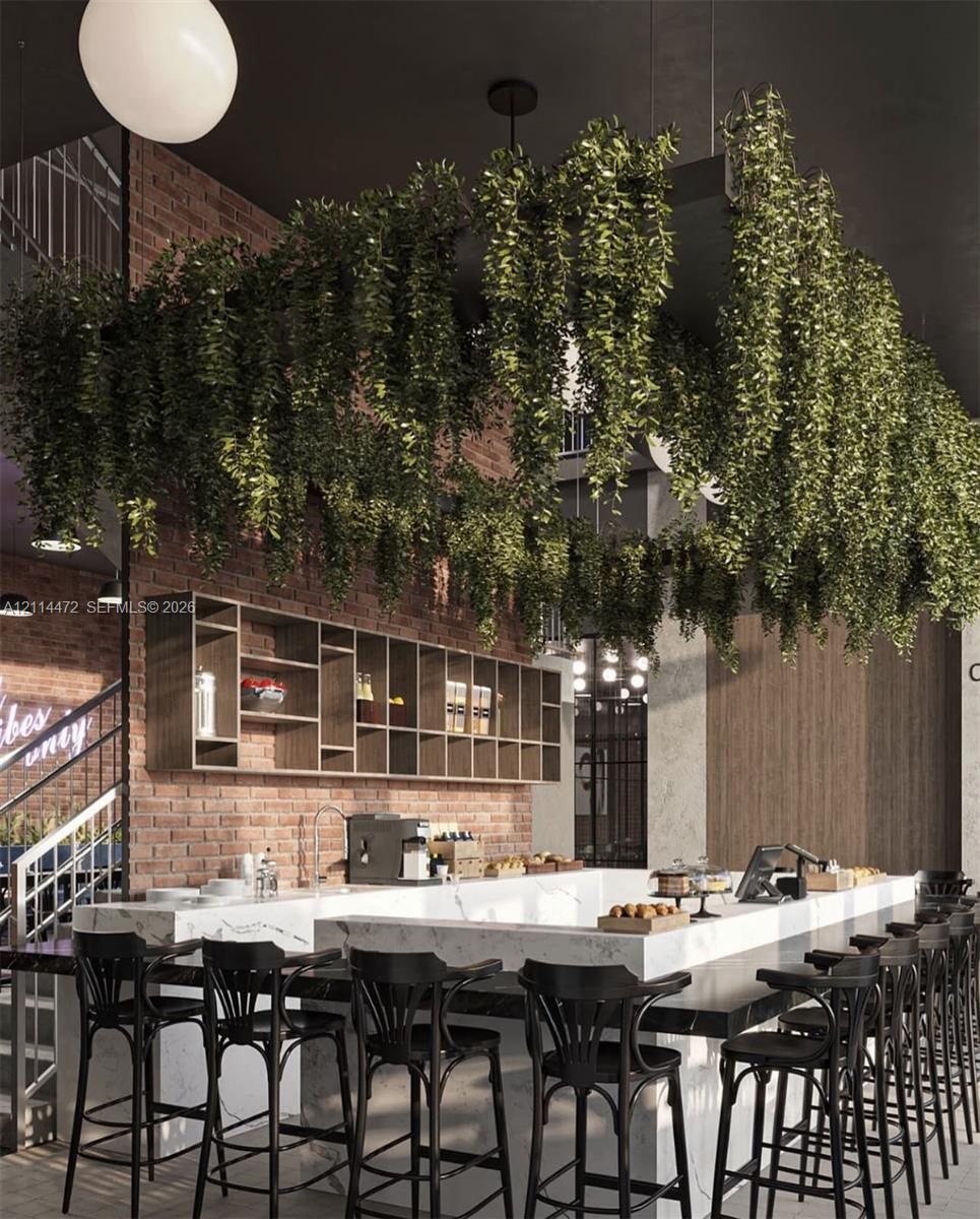 Exposed brick walls, custom built-in wood shelving, and a stone-topped bar counter featuring a prominent overhead suspended planter