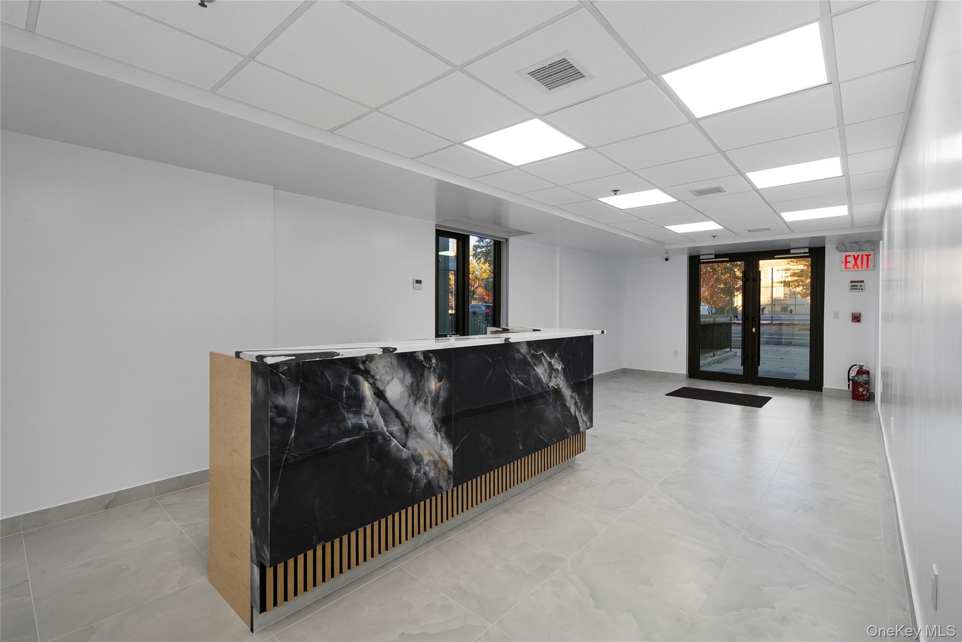 Welcome area featuring a drop ceiling