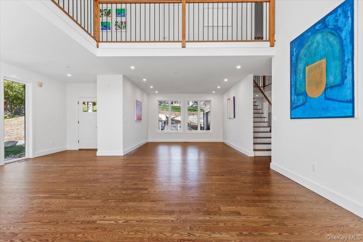 Living room looking up to mezzanine level