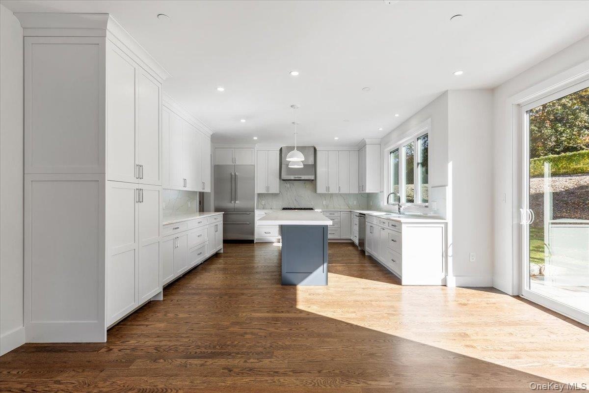 View to kitchen from family room, room for kitchen table.