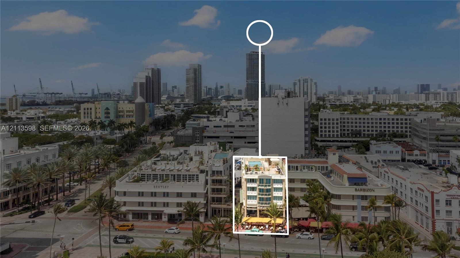 Aerial perspective of mid-rise property featuring a rooftop terrace with pool and multi-level balconies