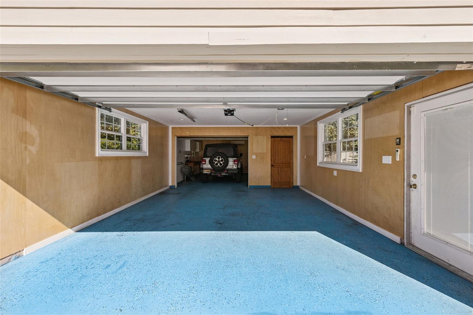 Another look at the Tandem garage with the backside currently holding a 4 door jeep and electric bikes, perfect for heading downtown on the bike trail