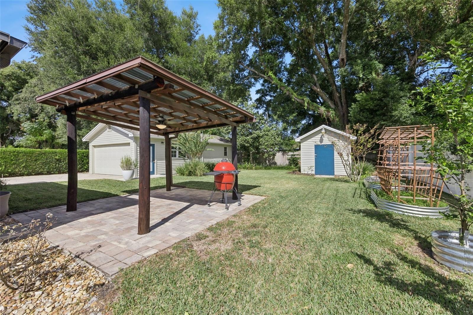 Covered Grilling Gazebo, 12x12 Shed and Fruit trees and lots of pineapples are back here too.