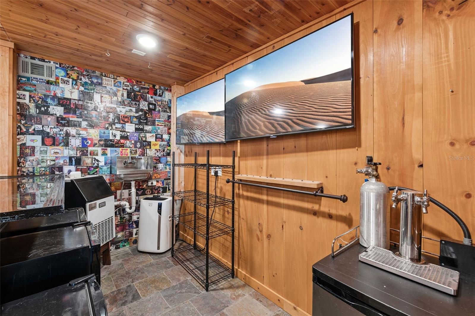 Another view of the bar set up with Ice Machine, Air conditioner, Sink, Kegerator, Wine Fridge and 2 additional fridges for your cans and glassware.  