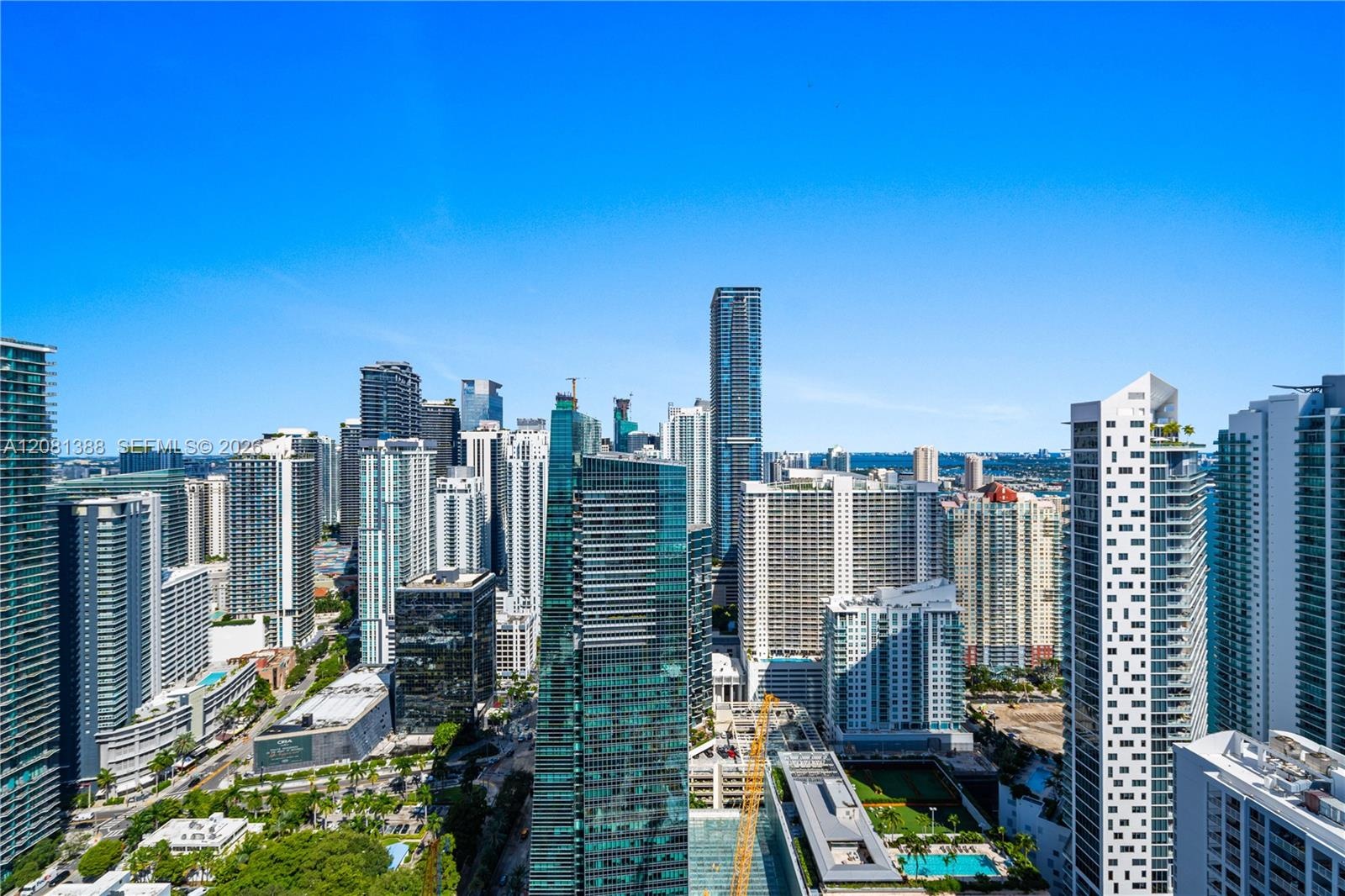 Elevated urban perspective showcasing the surrounding metropolitan skyline, high-rise architectural density, and expansive horizon