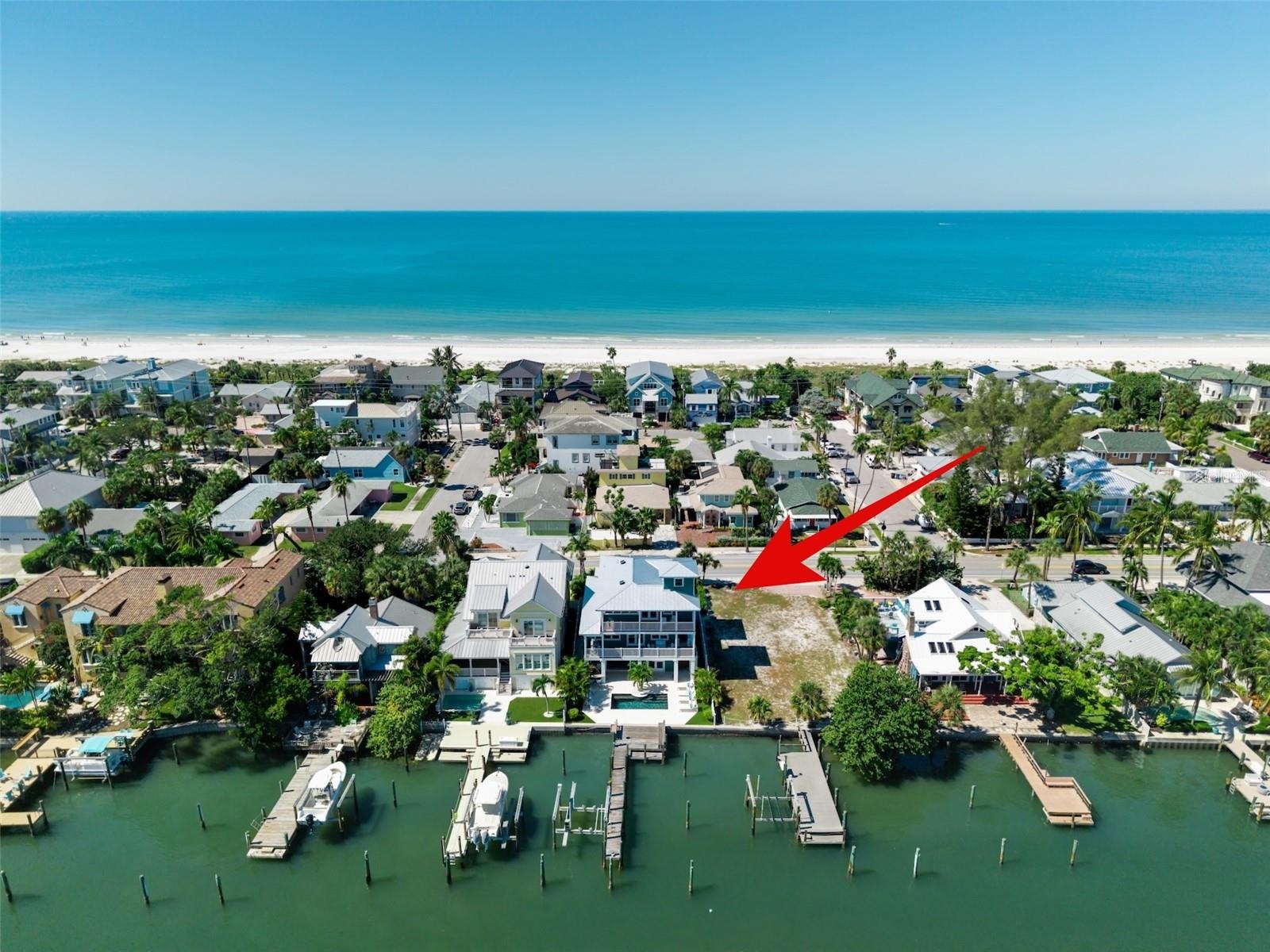 Count them 1, 2, 3 homes between the home and the white sandy beach