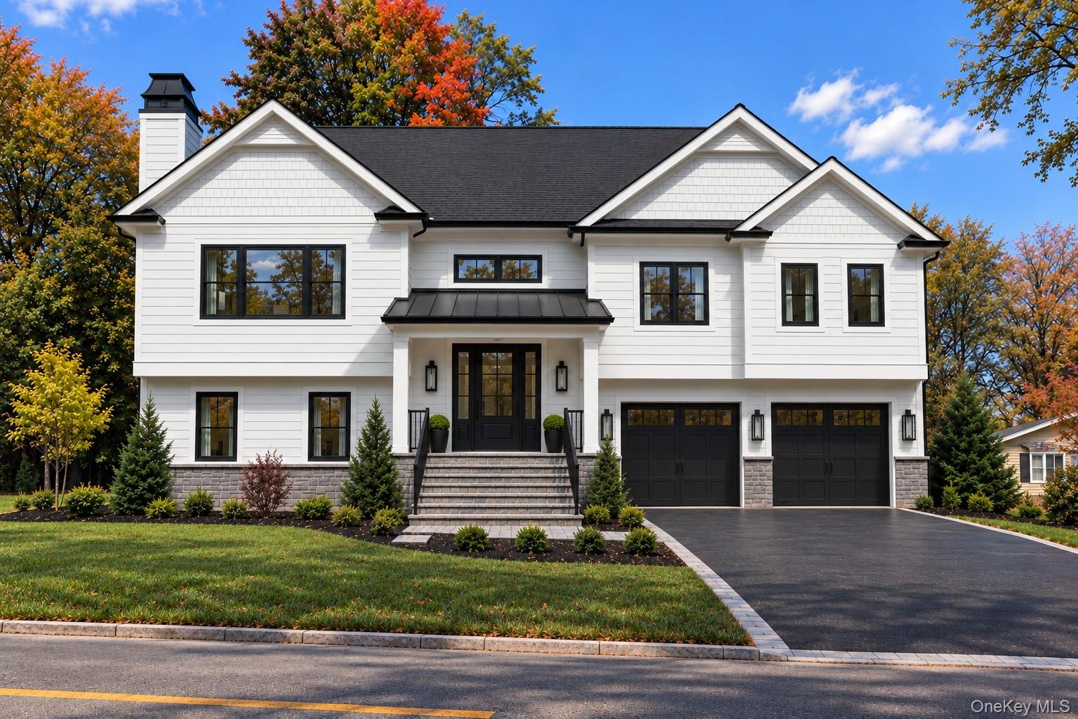 Front Exterior | Digitally Enhanced – Striking modern farmhouse design featuring James Hardie siding, contrasting black accents, architectural rooflin