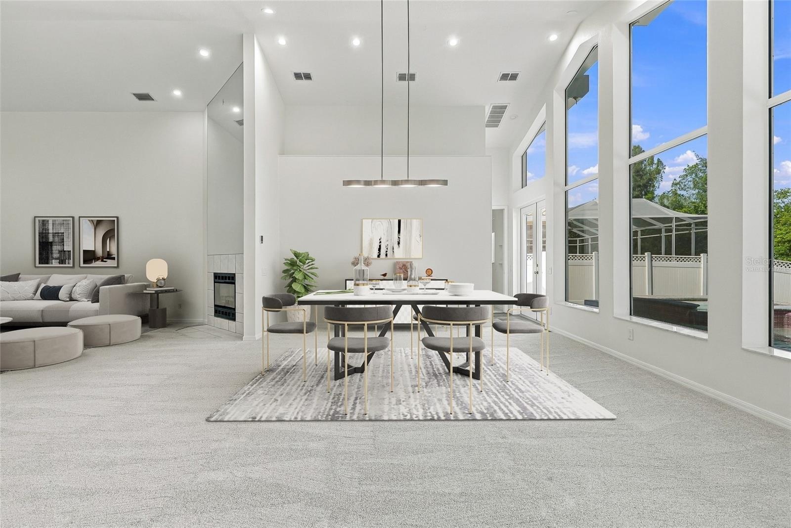 Imagine entertaining with views out these stunning windows overlooking the pool and natural preserve. Virtually staged.