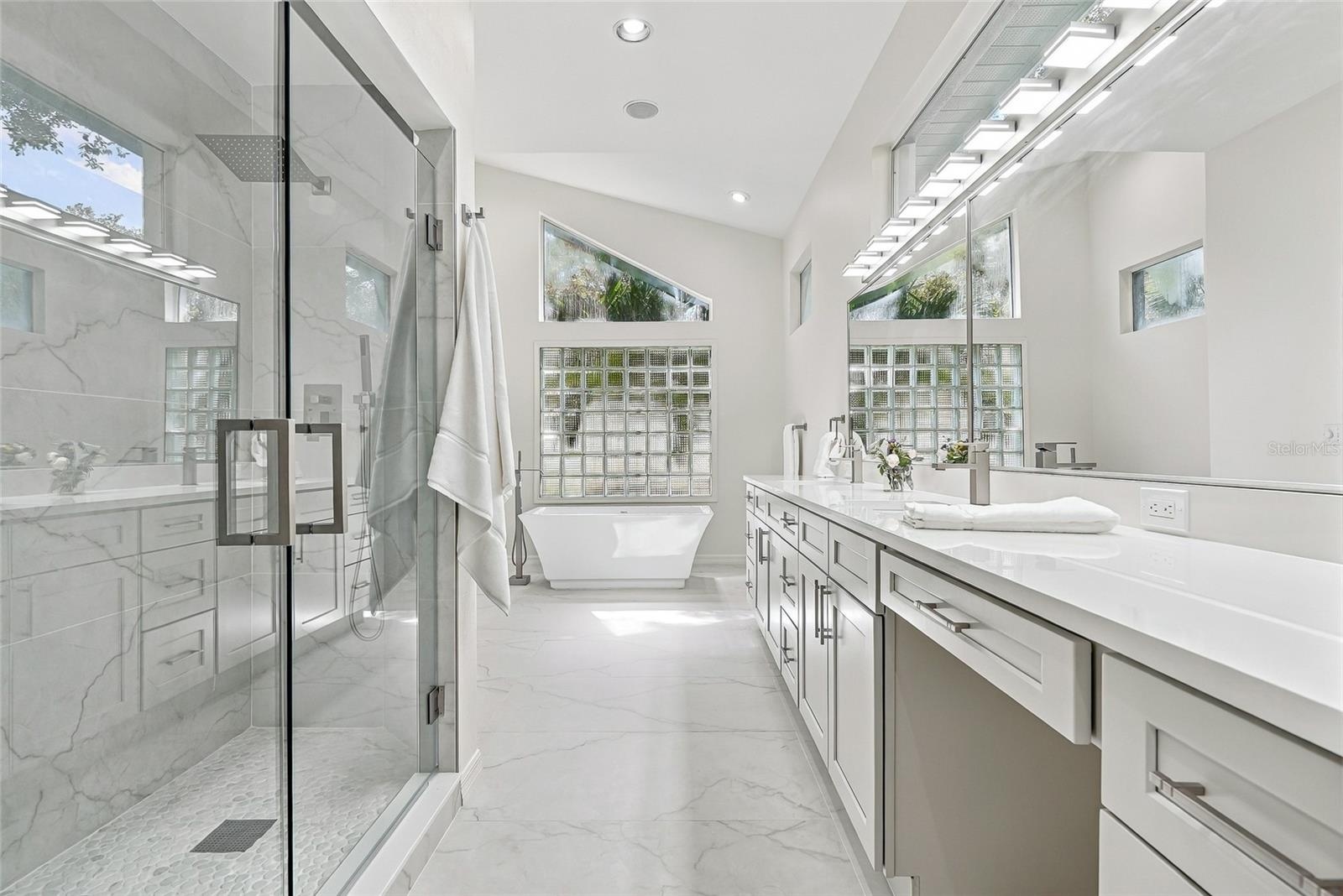 Recently updated primary bath creates a spa environment.