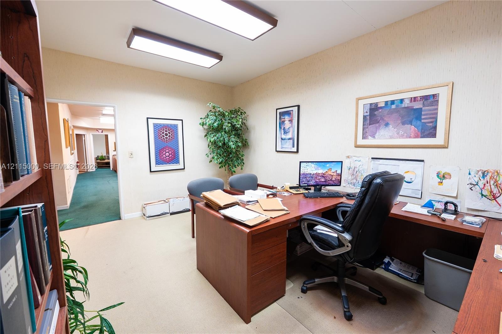 Room featuring neutral wall-to-wall carpeting, textured wall finishes, and overhead rectangular flush-mount lighting