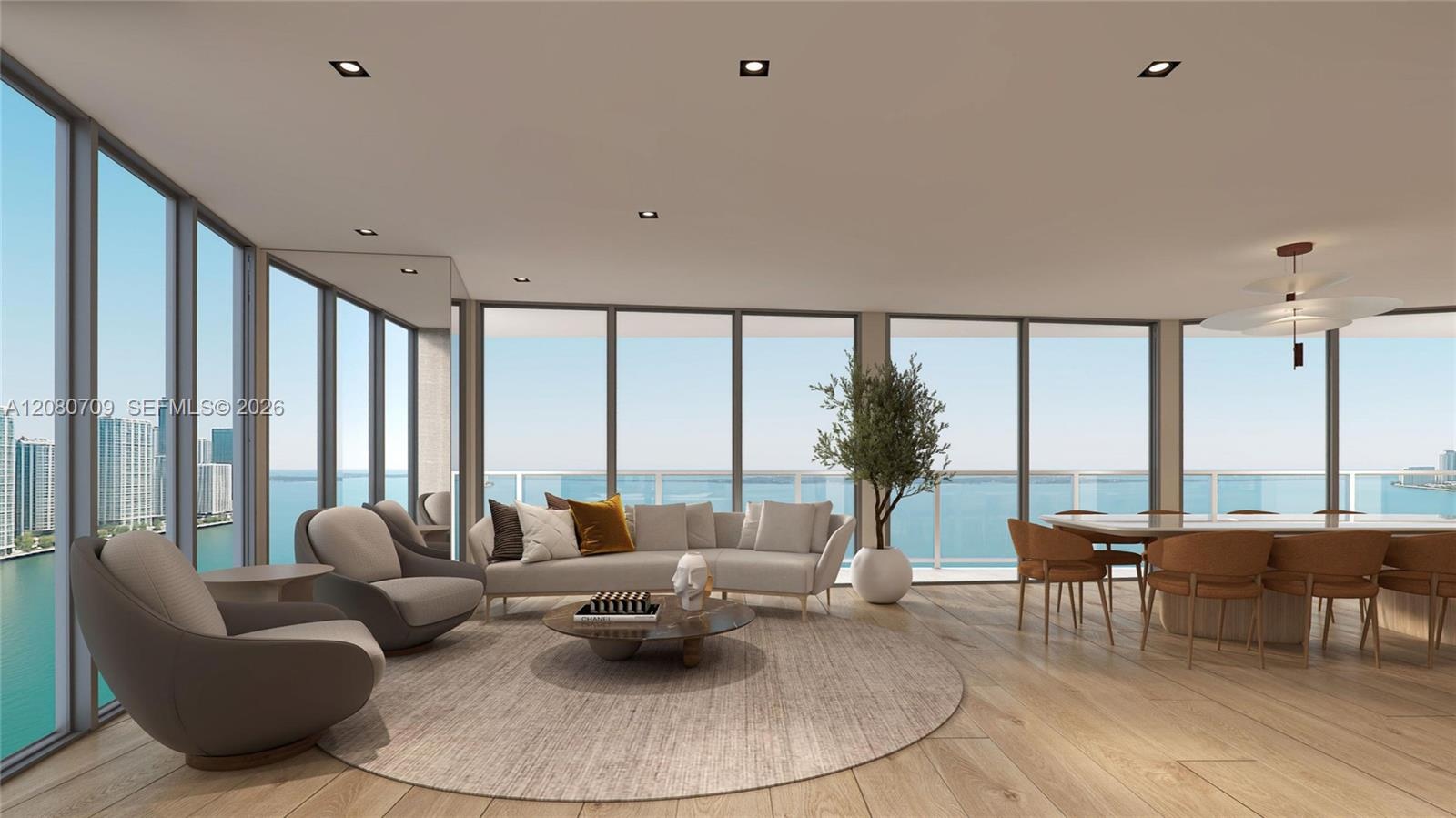 Open-concept interior featuring large-format tile flooring, recessed ceiling lighting, wall-to-wall sliding glass panels, and a textured stone feature