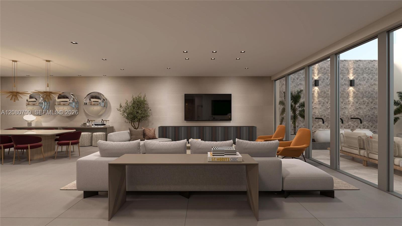 Open-concept interior featuring light wood-finish flooring, recessed lighting, and expansive floor-to-ceiling windows