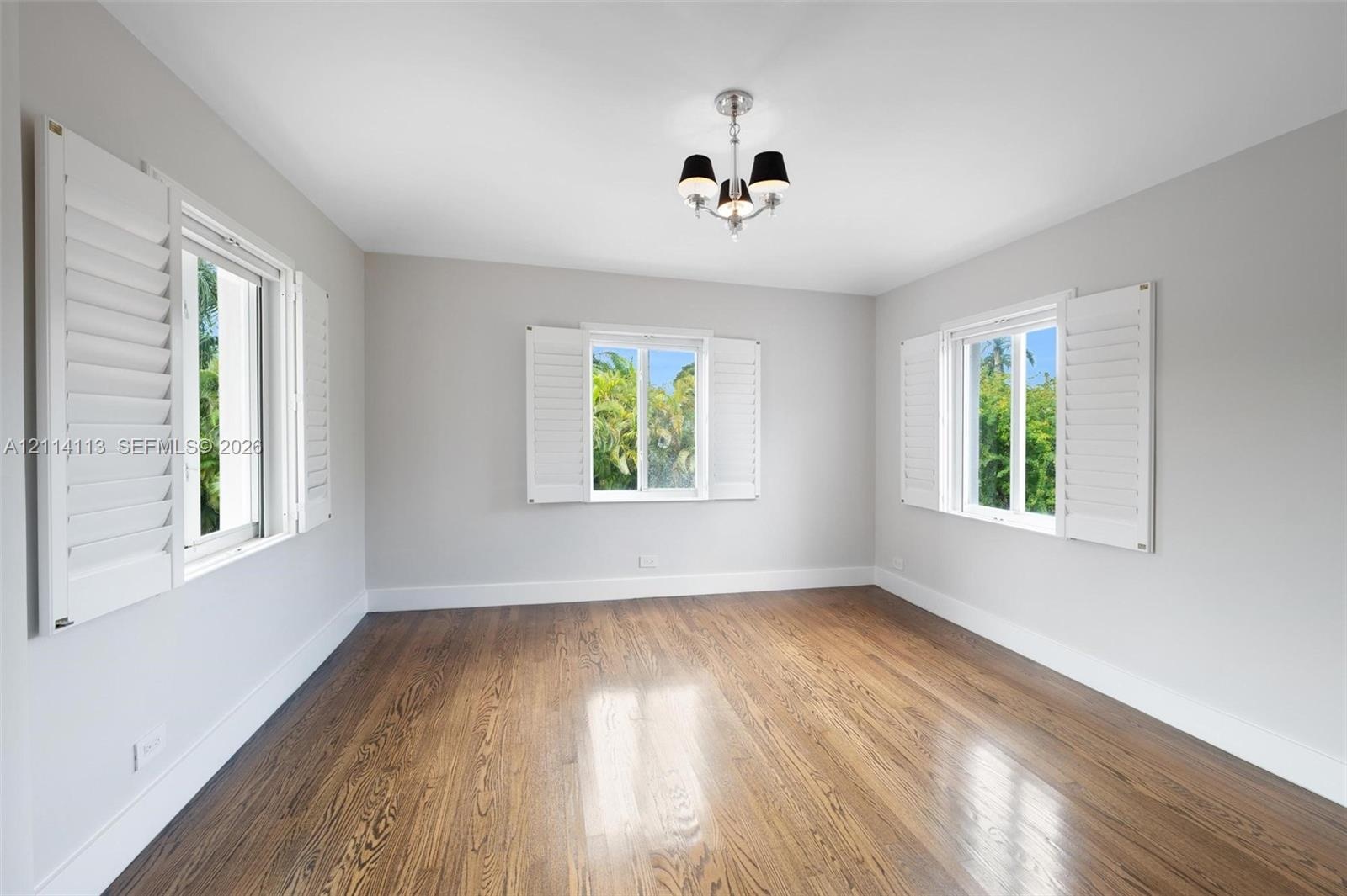 Wood-finish flooring, three windows with interior
