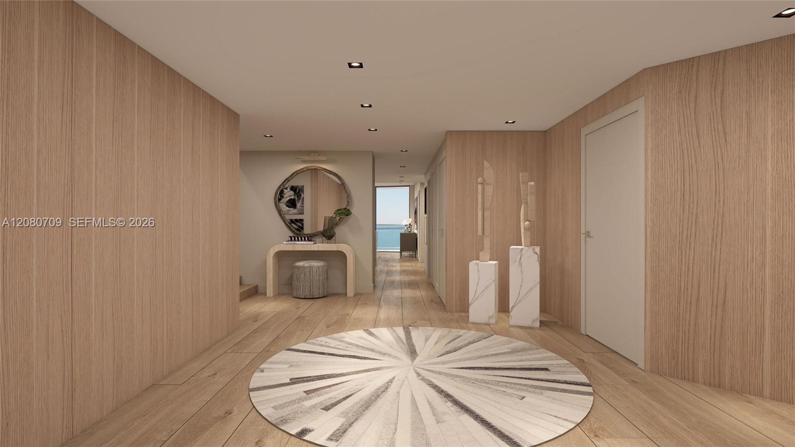 Interior space featuring light-toned wood-paneled walls, wood-finish flooring, and recessed ceiling lighting