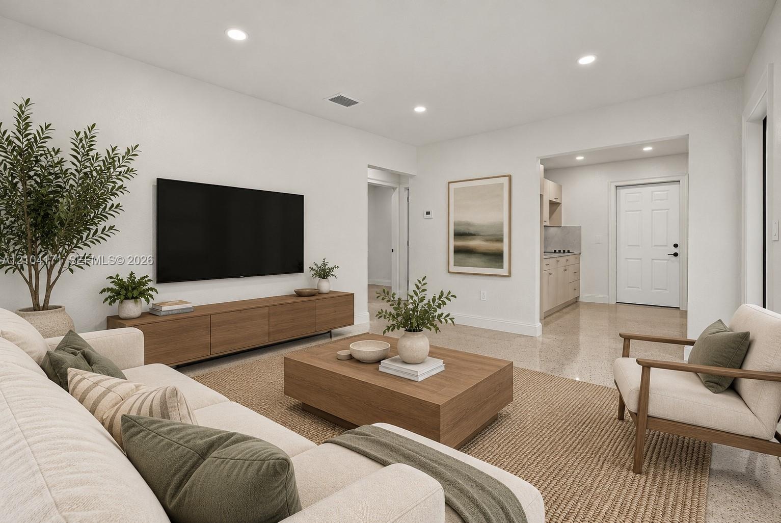 Kitchen featuring flat-panel cabinetry, stainless steel appliances, solid-surface countertops, a single-basin sink with a gooseneck faucet, and terraz