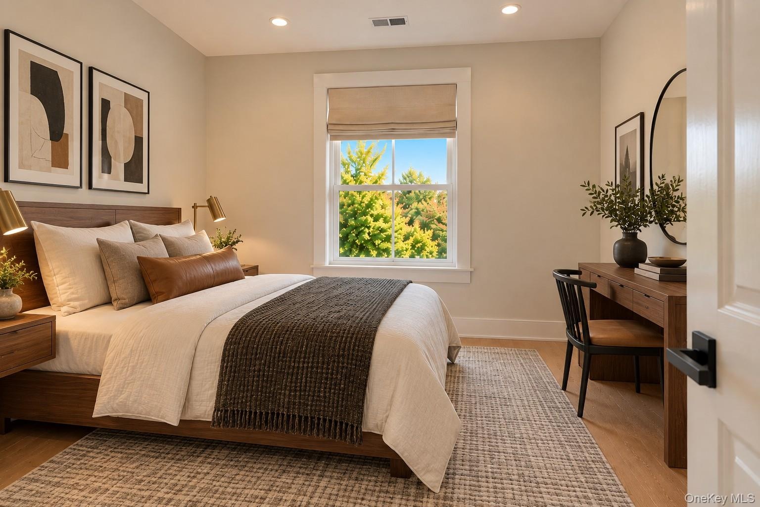 Bedroom 2 | Virtually Staged & Digitally Enhanced – Bright and inviting bedroom featuring beautiful white oak flooring, recessed lighting, and a large