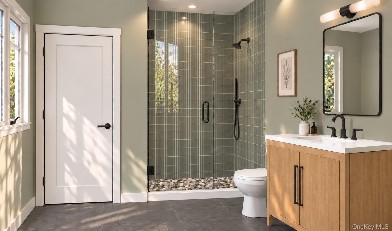 Lower Level Full Bathroom | Virtually Staged & Digitally Enhanced – Beautifully appointed with a glass-enclosed shower featuring floor-to-ceiling tile