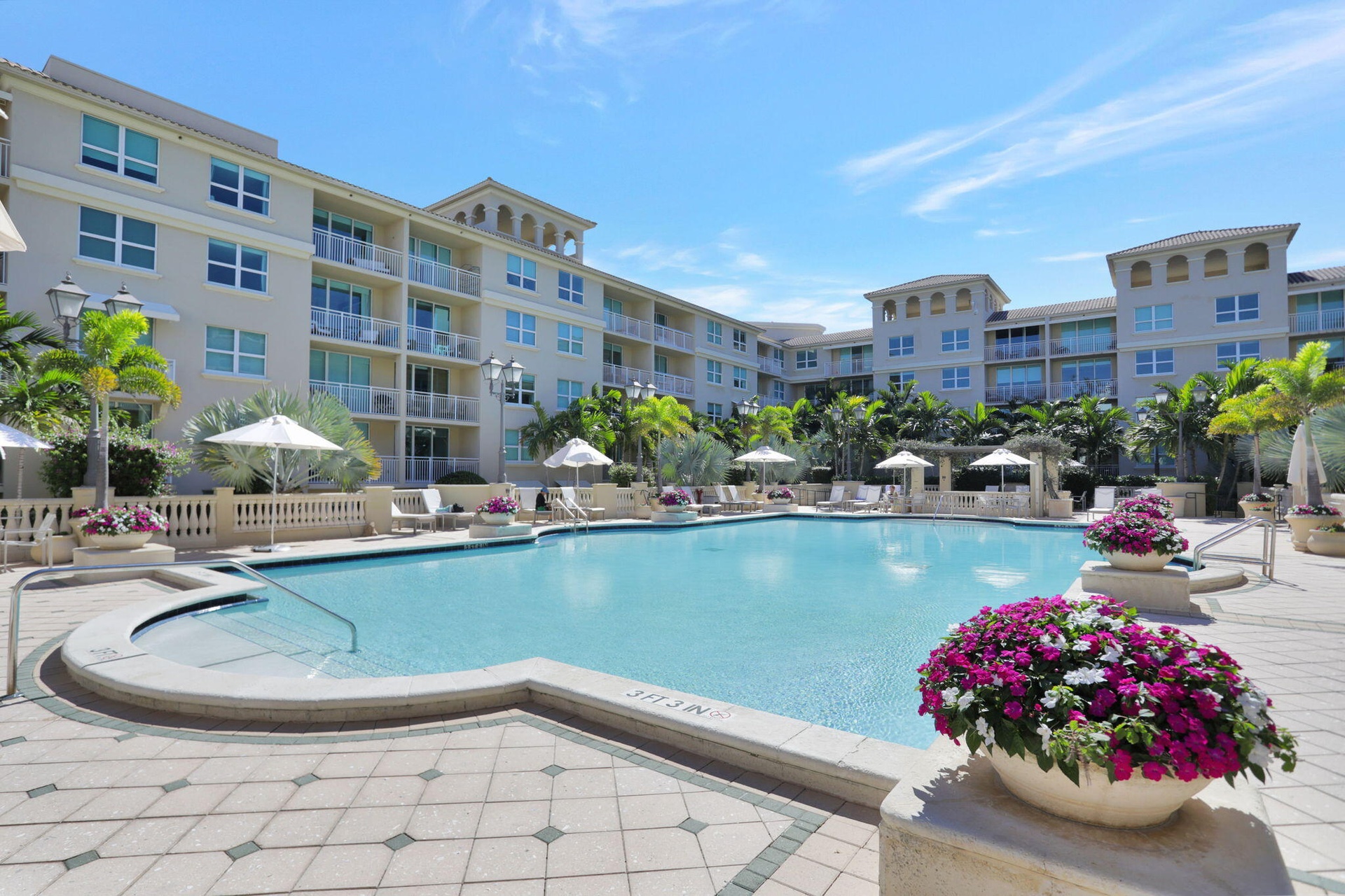 Expansive resort-style pool with dedicated lounge areas.
