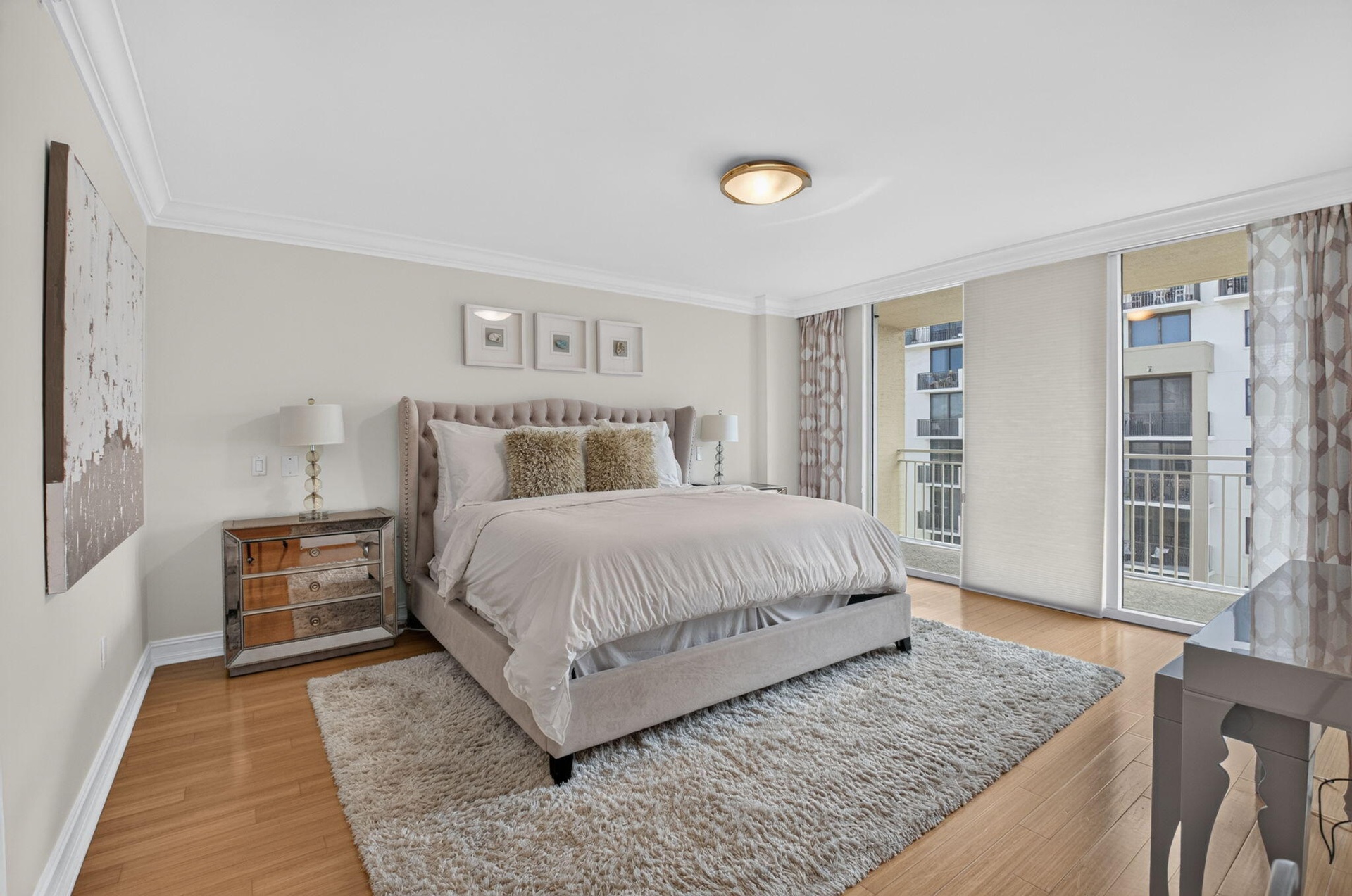 Primary bedroom with private balcony.
