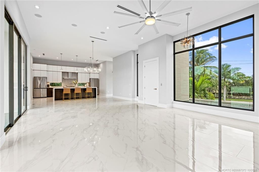 Upstairs Living and Dining Area Leading to the Balcony and Overlooking the Pool