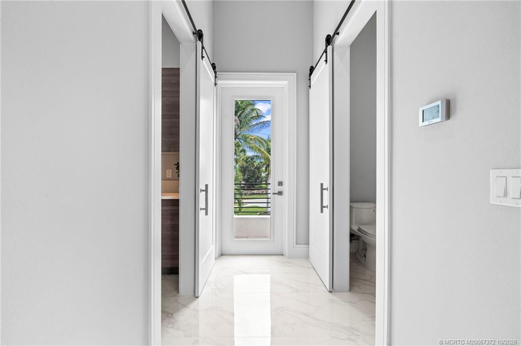 Hallway Off Kitchen leading to Laundry and Half Bath