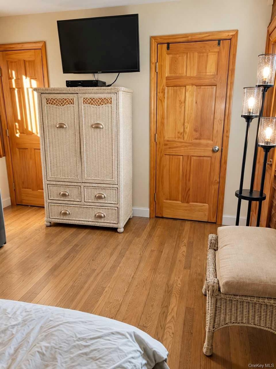 Primary Bedroom showing walk-in closet door and bathroom door