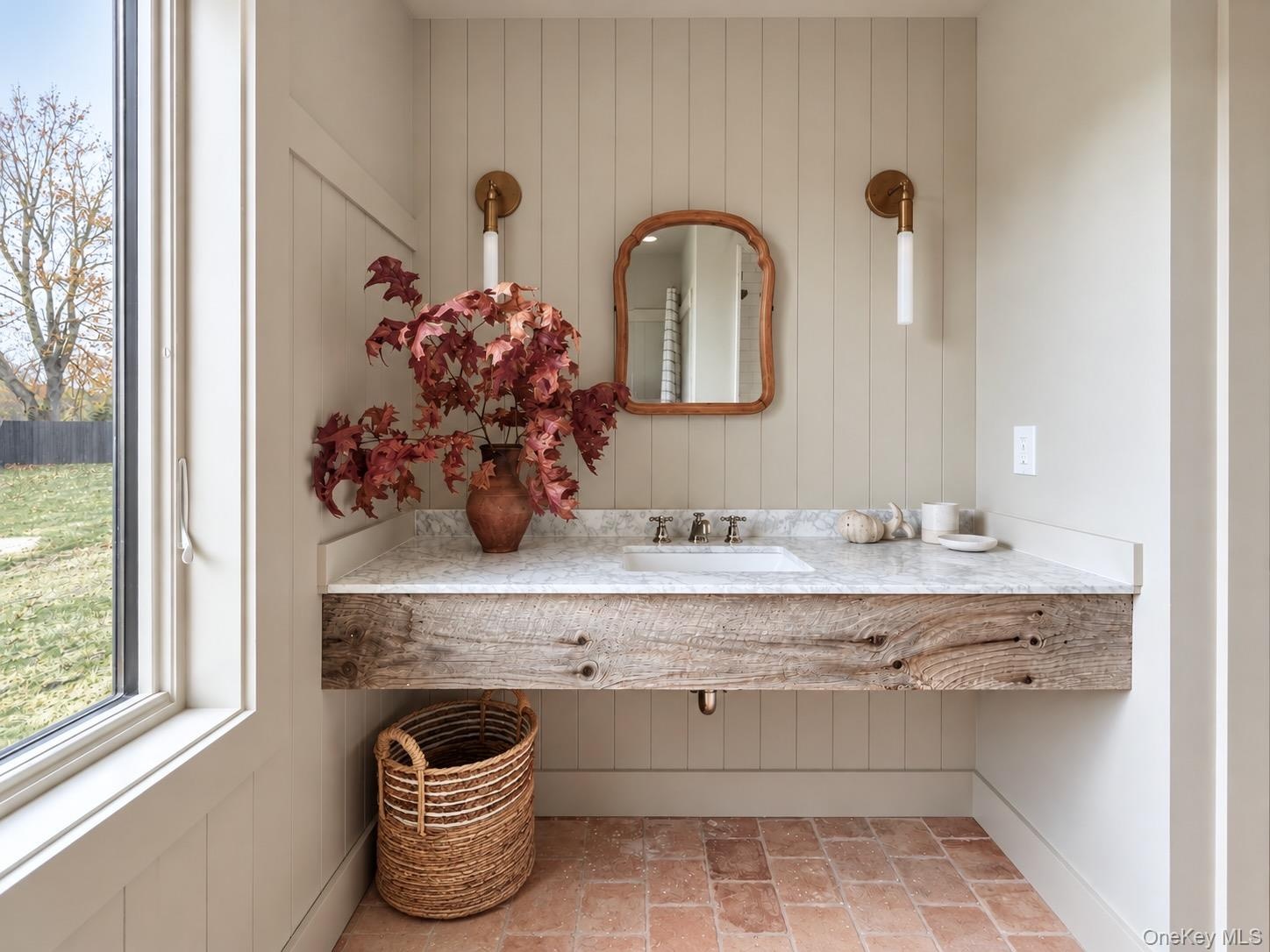 Full Bathroom with Terra Cotta Tile Floor, Carrara Marble Top Sink