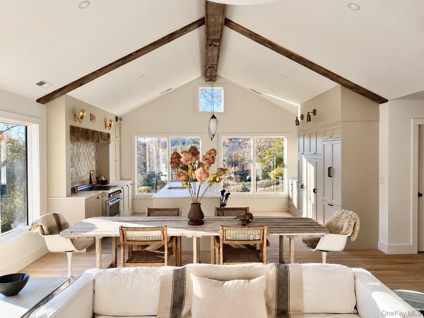 Dining Area is Light Filled from All Sides with Vaulted Ceiling