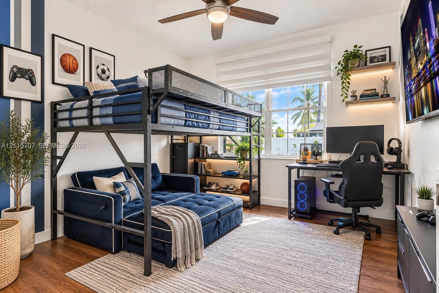 Wood-finish flooring, ceiling fan with integrated light fixture, large multi-pane window, and two floating wall shelves with recessed accent lighting