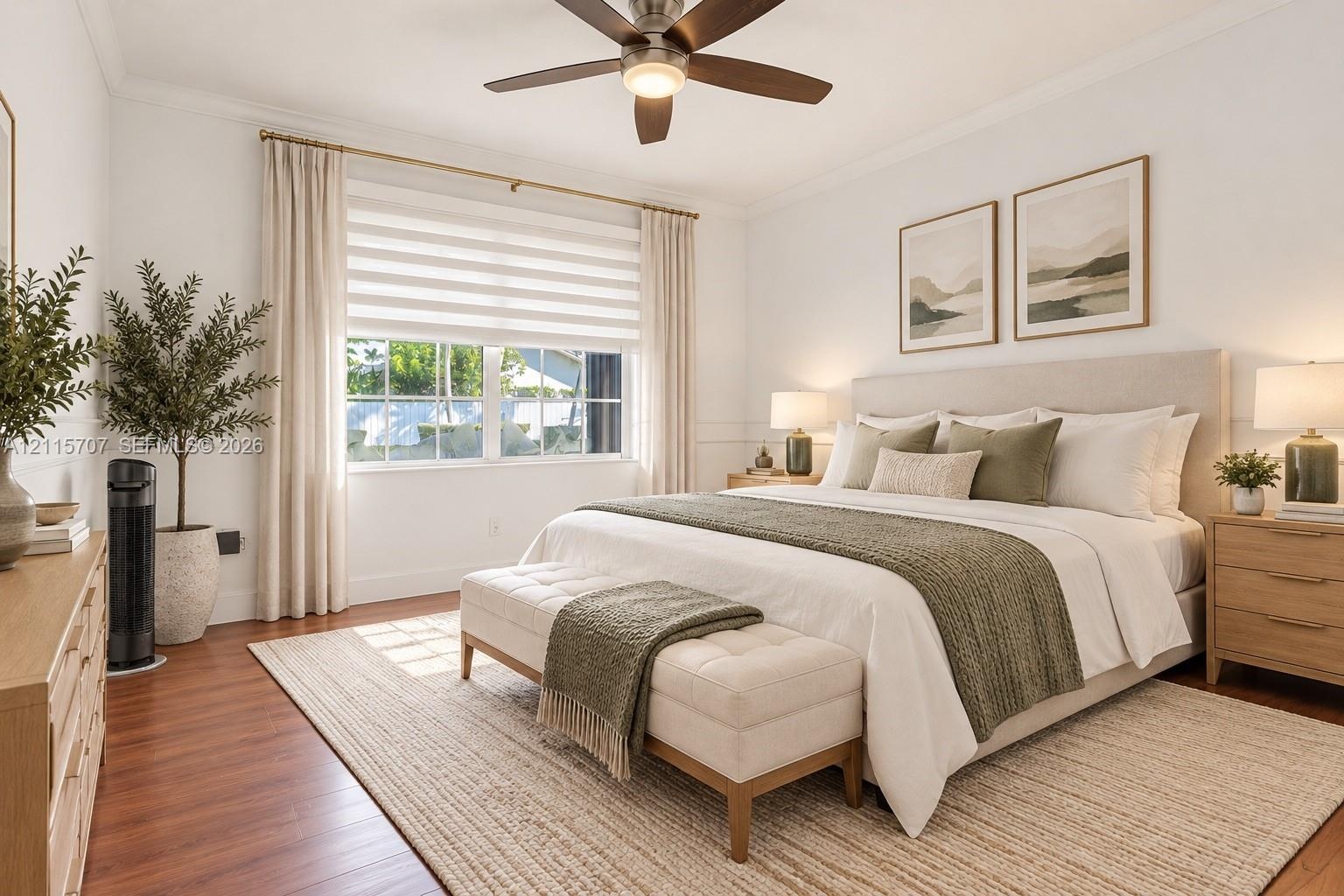 Neutral-toned interior featuring wood-finish flooring, a multi-blade ceiling fan with integrated lighting, dual-pane windows, and minimalist wall mold