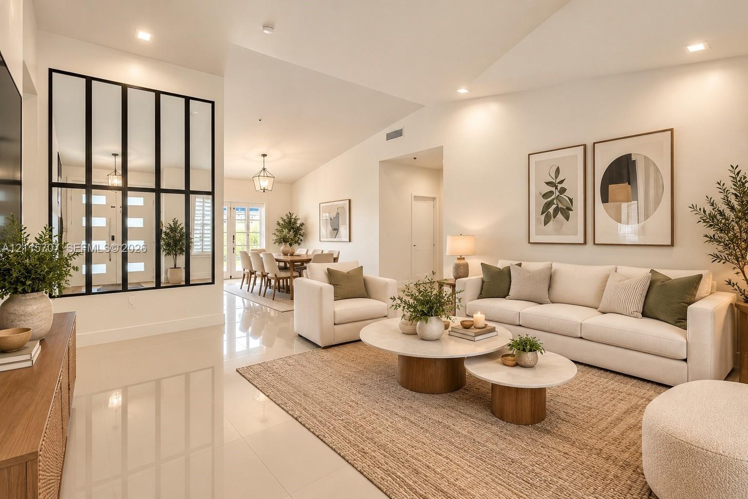 Vaulted ceilings, polished tile flooring, recessed lighting, and a prominent black-framed glass wall partition