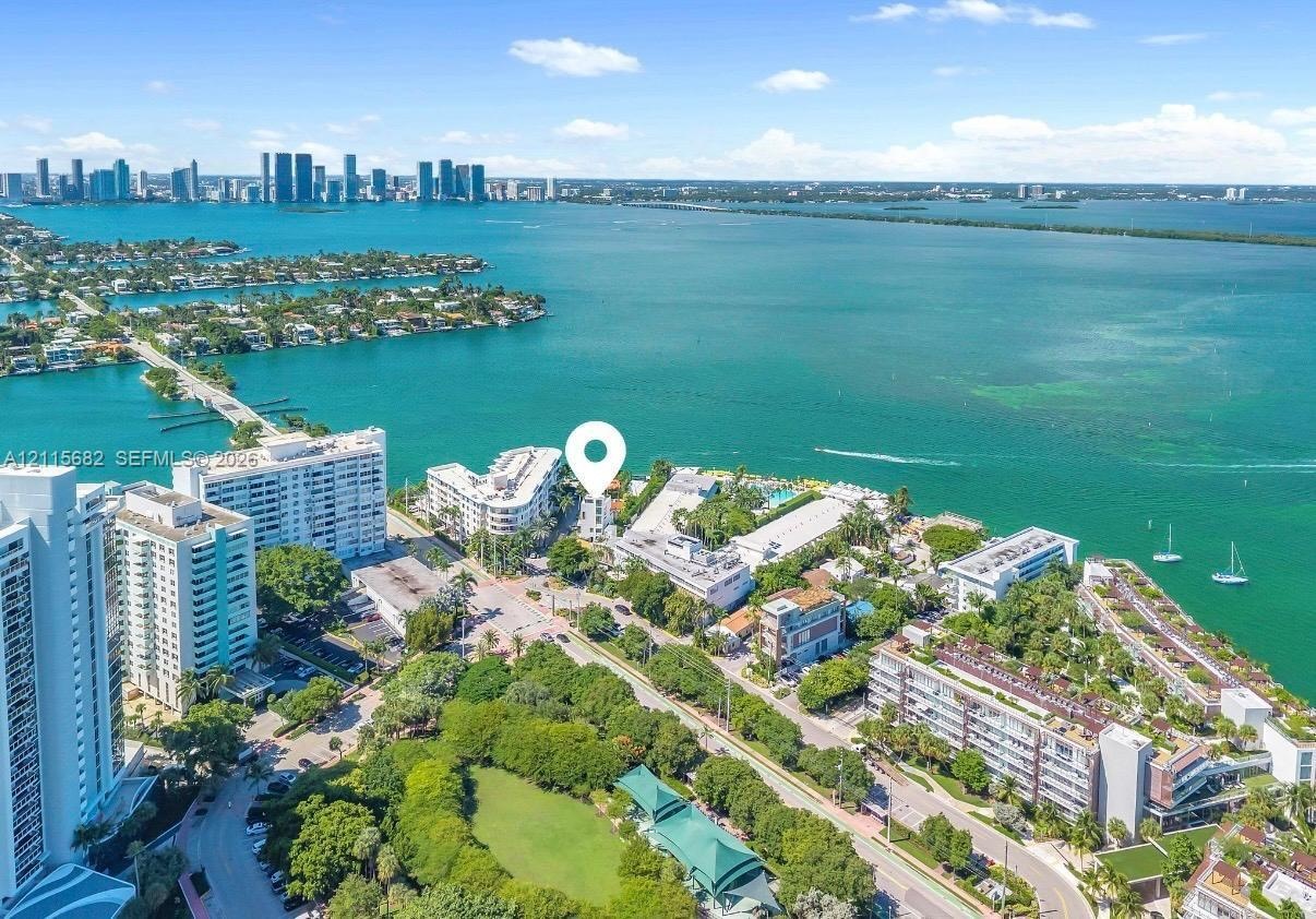 Aerial perspective featuring coastal waterfront location, proximity to local harbor, and surrounding maritime environment