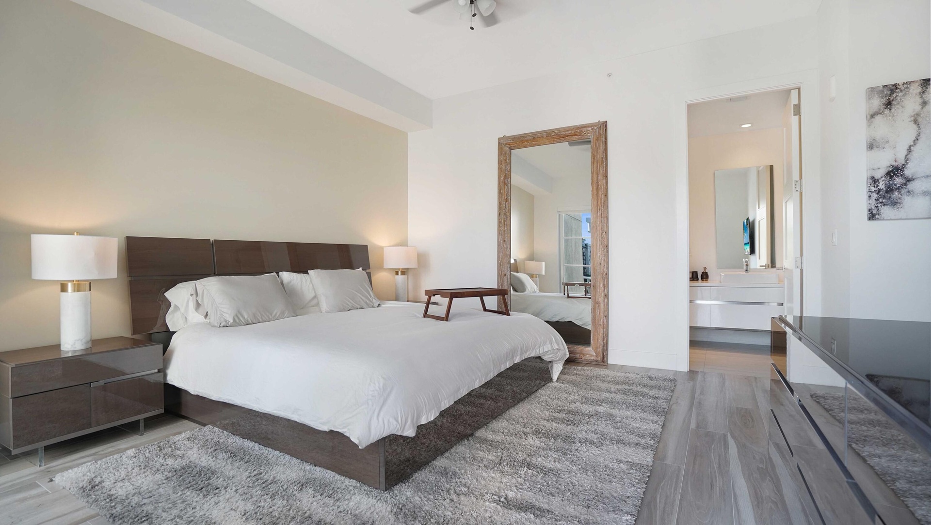 Generously proportioned primary suite in Tower 155 Residence 301, offering privacy and refined contemporary design.