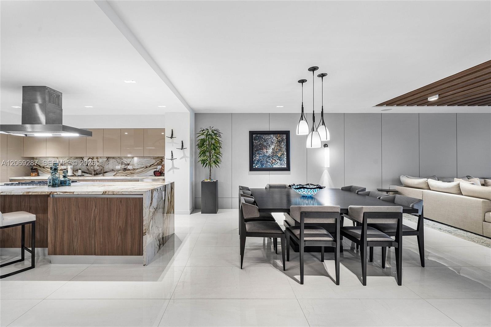 An elegant dining area offering beautiful waterfront views and a seamless setting for entertaining.