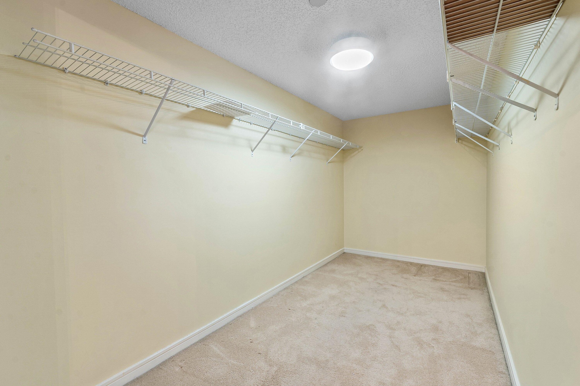 1 of 4 Large walk-in closets in the master bedroom provides substantial hanging and storage capacity.