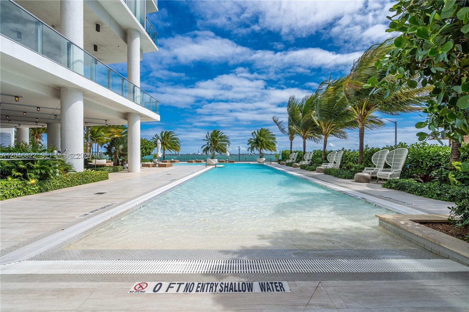 Expansive pool deck with bay views at Biscayne Beach