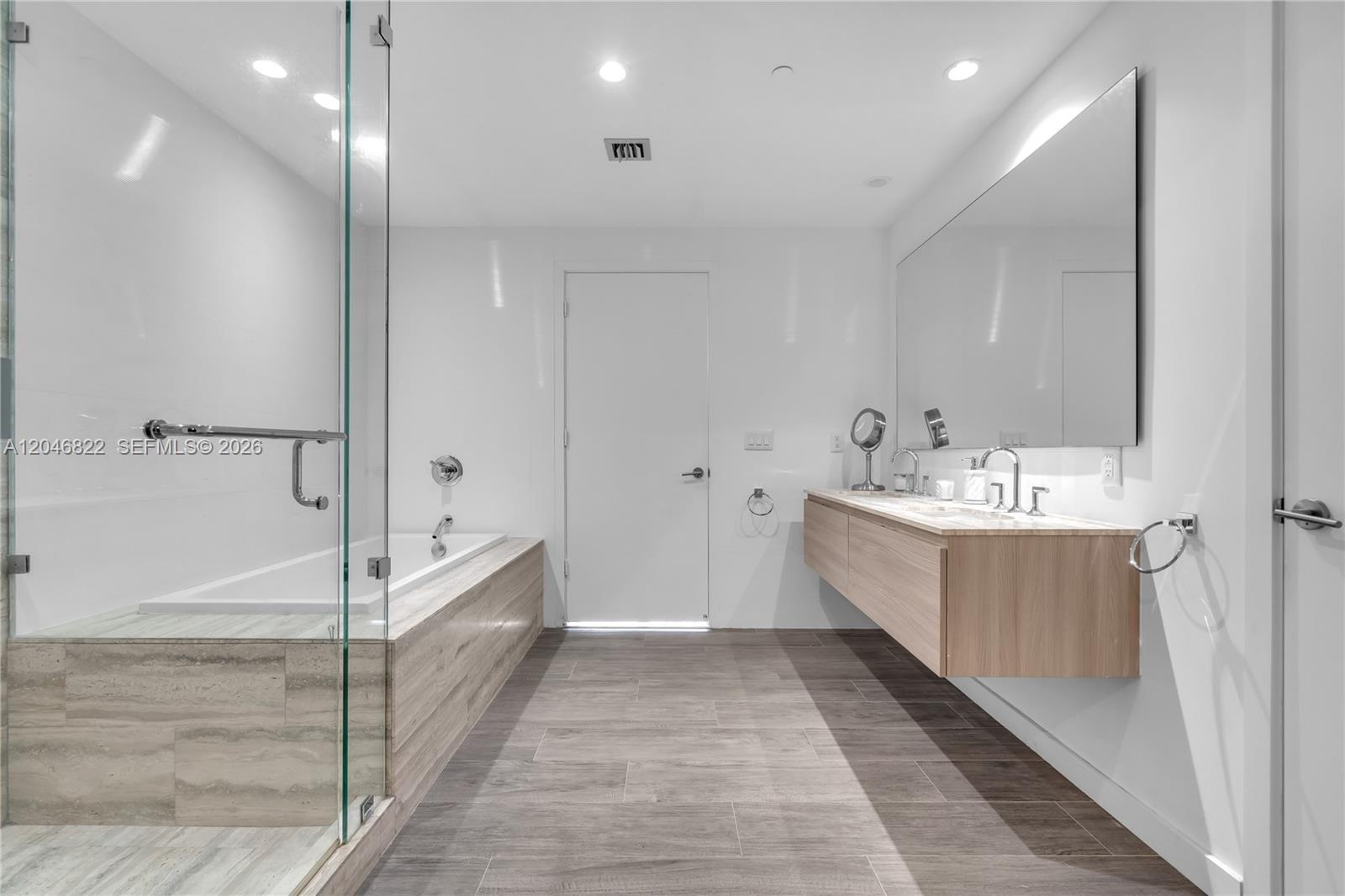 Oversized walk-in closet with fully built-out cabinetry