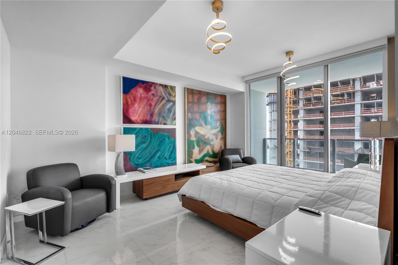 Spa bath with dual-sink floating vanity and wood-look tile
