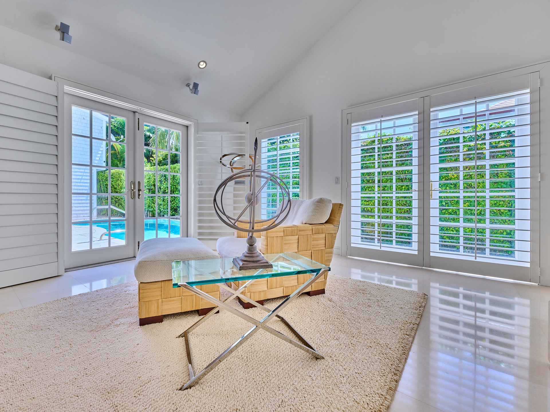 Walls of French doors fill the space with natural light