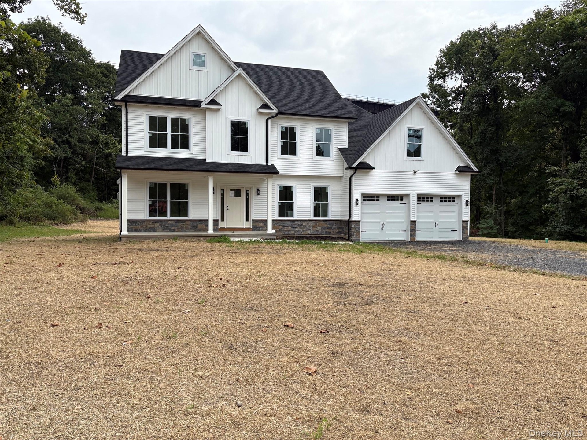 Beautiful colonial situated on level property surrounded by forever green.
