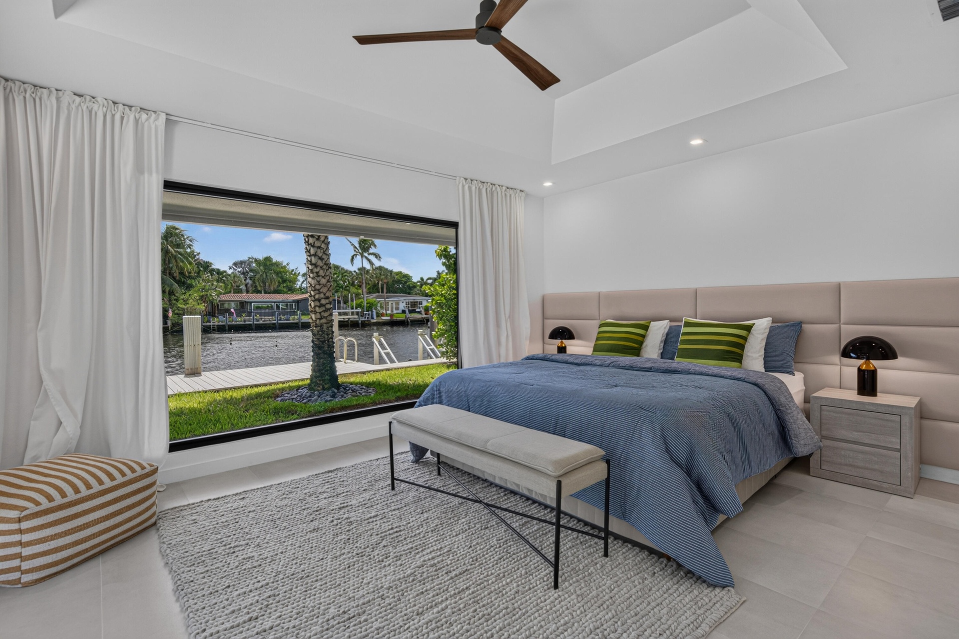 Second Primary Bedroom with waterfront and pool views