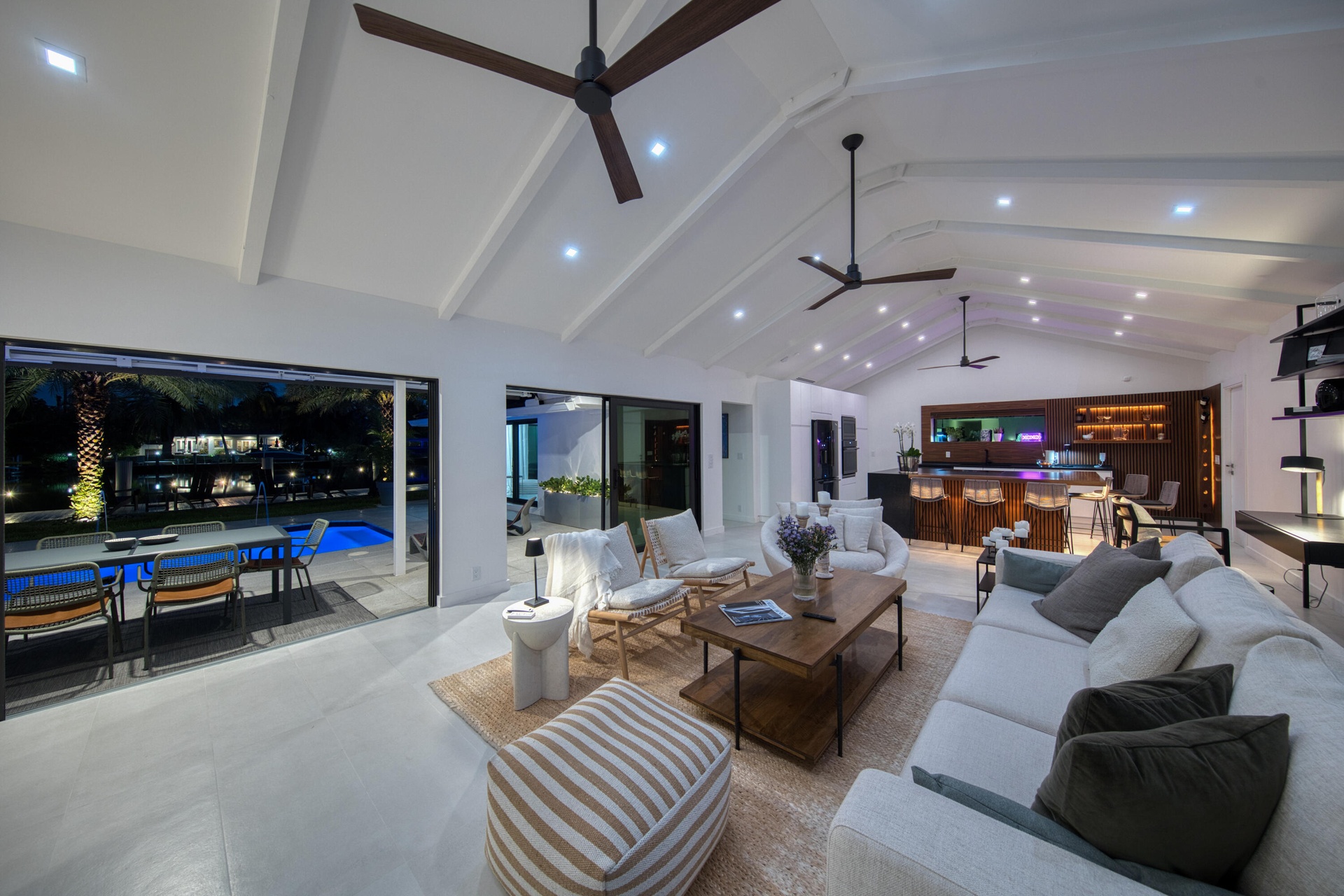 Gorgeous cathedral ceilings enhance the home’s spaces and character looking out toward the pool