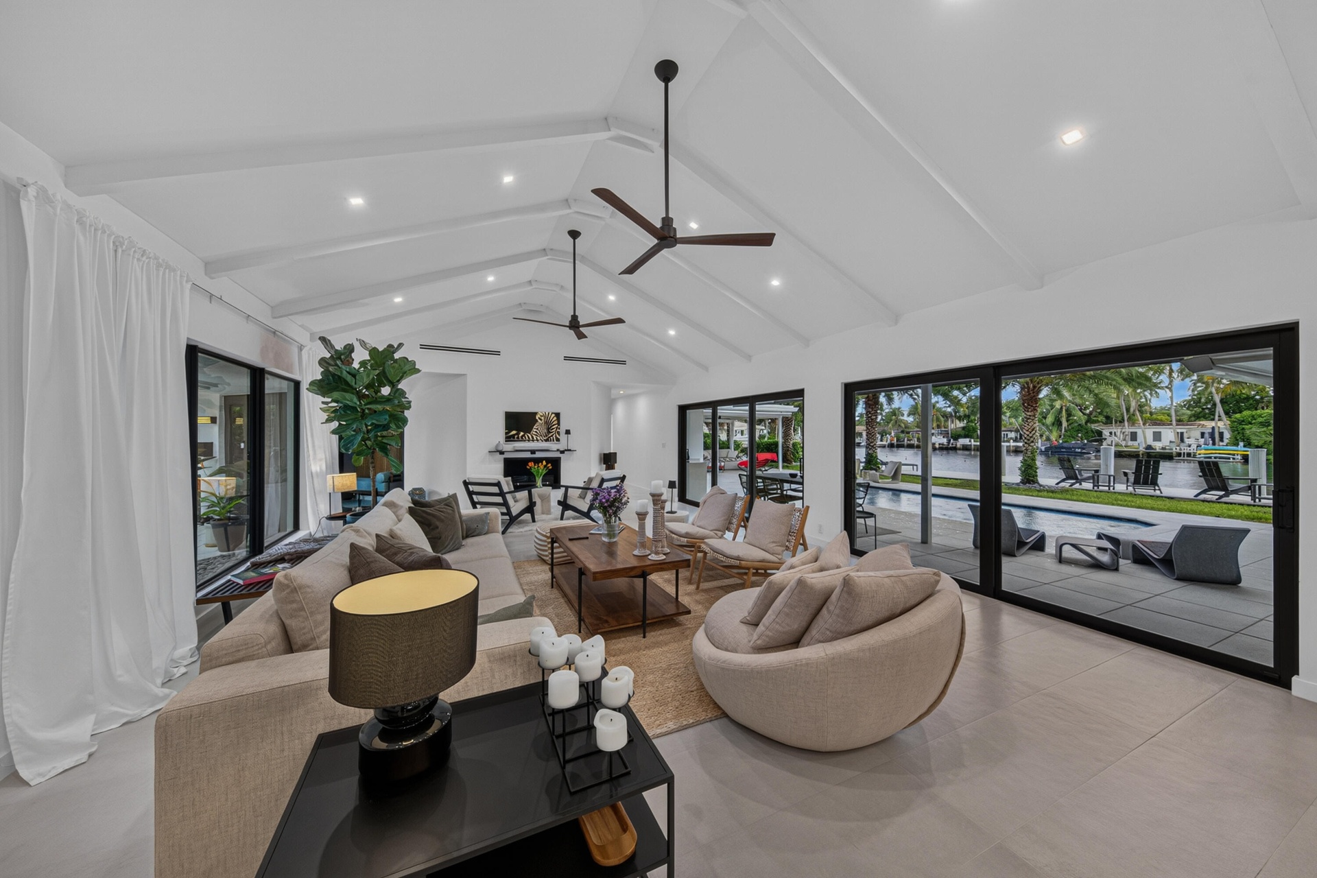 Living area opens to the pool and back patio for enjoyment and entertainment.