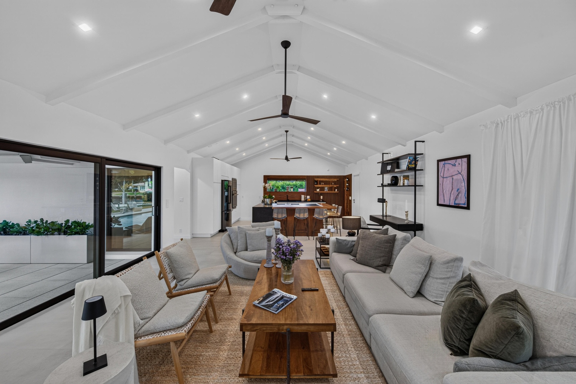 Stunning cathedral ceiling in living, dining areas and kitchen